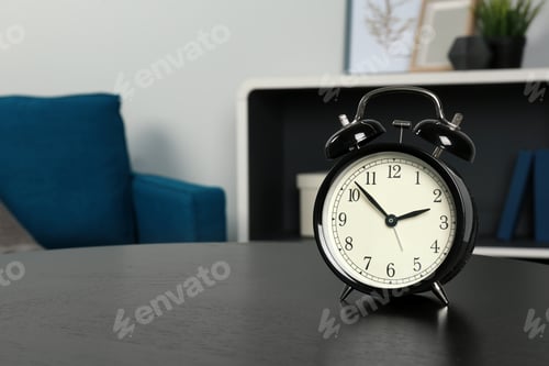 Preview: Alarm clock on table indoors, space for text. Time management
