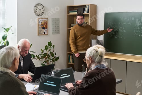 Preview: Middle Aged Caucasian Man Teaching Senior Adults Computer Literacy Course