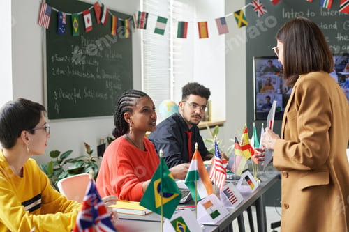 Preview: Female Teacher Talking to Students at School