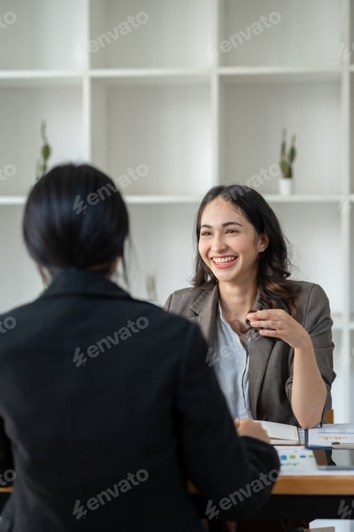 Preview: Business idea creative brainstorming sessions for projects Strategic topic of two Asian girls workin