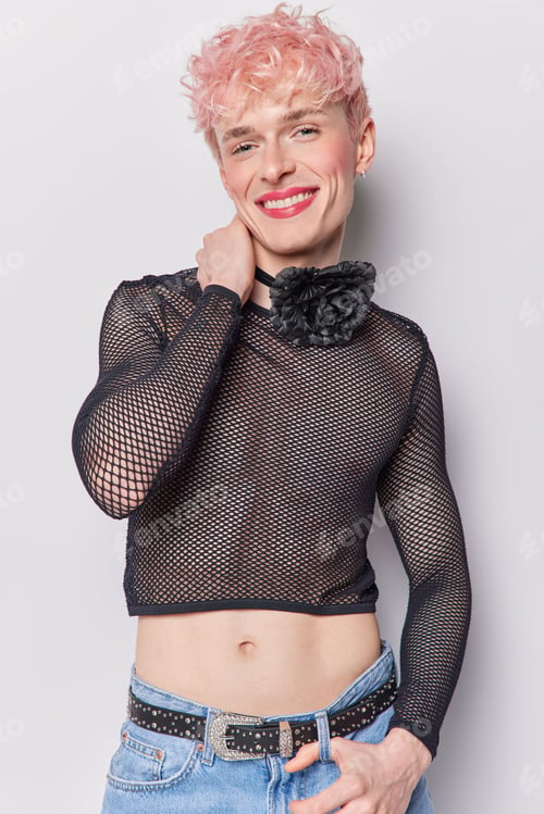 Preview: Vertical shot of sensual androgynous transgender young man with makeup enhancing his features