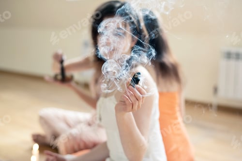 Preview: ↟ Beautiful girls sitting in lotus position meditate during yoga session at sports studio