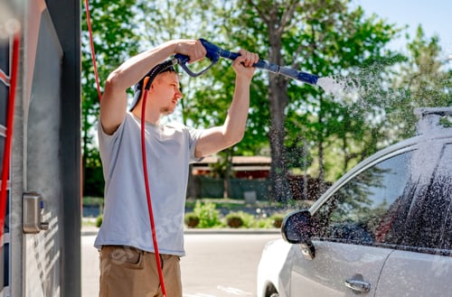 Preview: Shot of a man washing his car