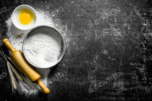 Preview: Flour in a sieve with a rolling pin and spikelets.