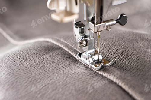 Preview: Modern sewing machine and gray fabric. Sewing process, handmade, hobby, DIY, business, repair