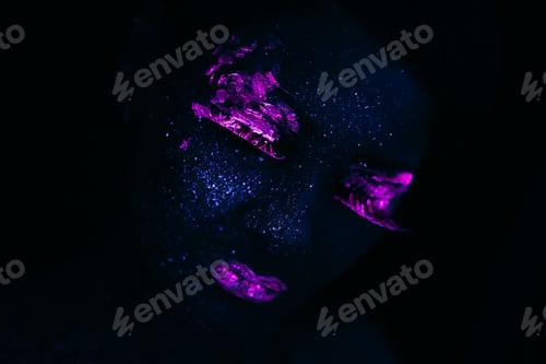 Preview: Portrait of Fashion Woman in Neon UV Light. Model with Fluorescent Creative Psychedelic Make Up