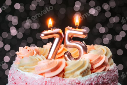 Preview: 75th birthday cake with glowing candles and festive decorations