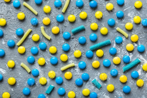Preview: colorful candies as background top view. Seamless pattern with candy. Many sweet candies close-up