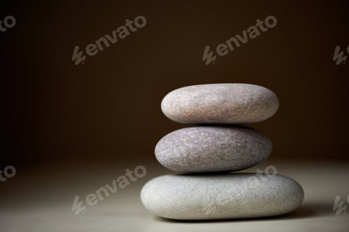 Preview: Searching for ones inner balance. Three stones balanced on top of each other in natural light.