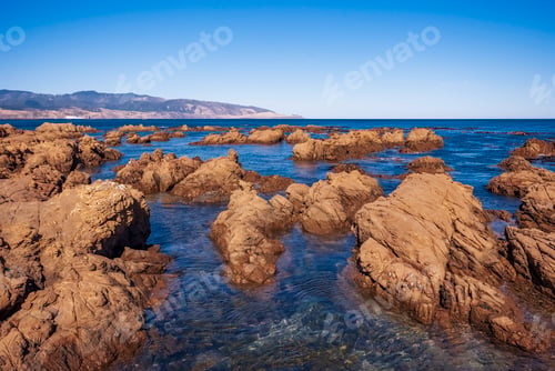 Preview: South Coast of Wellington city in New Zealand with a view of Cook Strait on a peaceful autumn day.