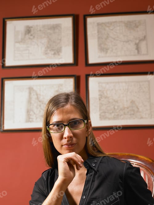 Preview: Business woman looking at camera