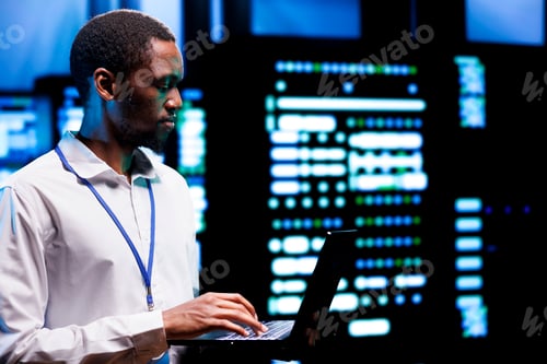 Preview: Engineer inspects blade servers