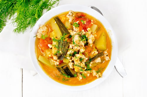 Preview: Ragout of zucchini and minced meat in plate on board top