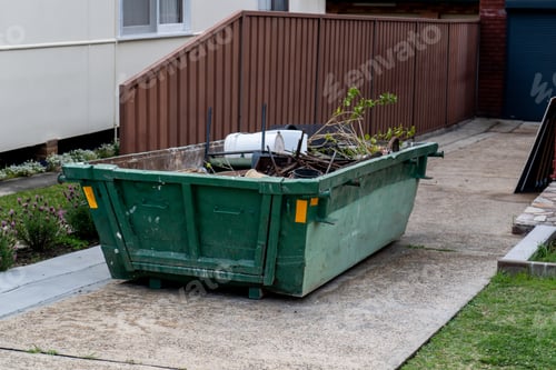 Preview: Skip bin full of household waste rubbish. House clean up and renovation concept. Waste management