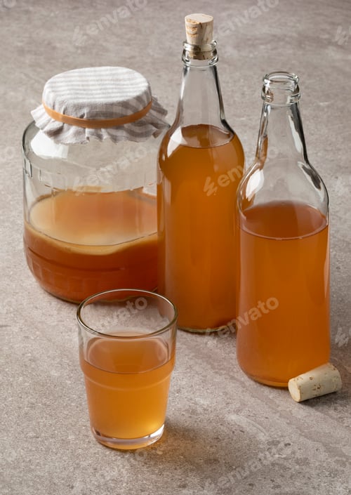 Preview: Jar, bottle and glass with Kombucha drink close up