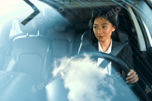 Preview: Woman sitting in a car