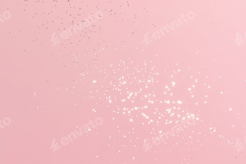 Vista previa: Brillo plateado brillante sobre fondo rosa