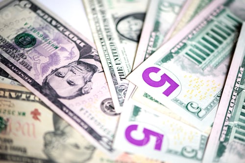 Preview: A part of US dollars on white background, full frame