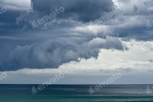 Preview: Storm clouds rolling in over the South Pacific and Pebbly Beach at the Murramarang National Park.