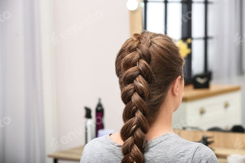 Preview: Woman with braided hair in professional salon