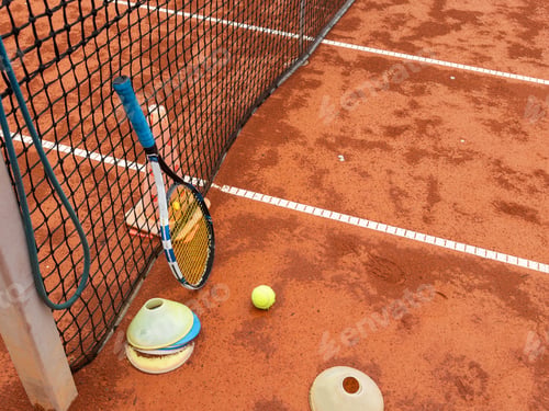 Preview: tennis racket with a tennis ball on a tennis court