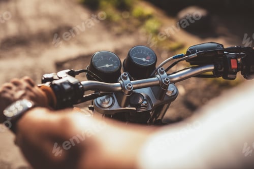 Preview: Man riding motorcycle on road