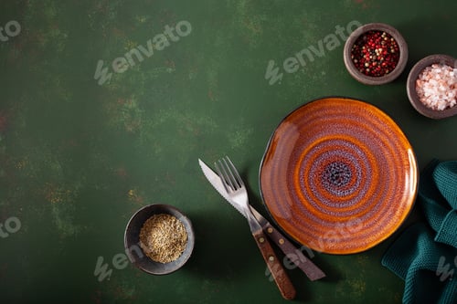 Preview: empty plate fork knife on concrete background