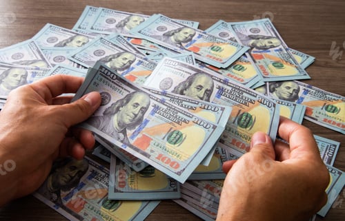 Preview: Hand counting money USD 100 note