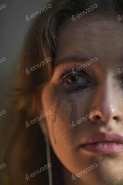 Preview: Portrait of Young Adult Caucasian Woman Crying with Tear Streaks on Face