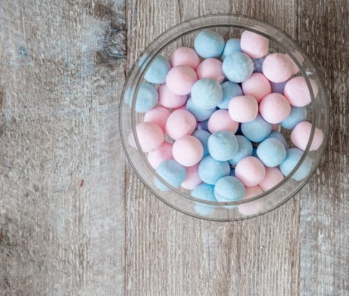 Preview: pink and blue candies on a wooden background