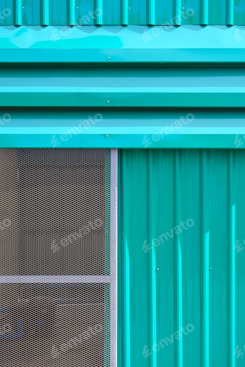 Preview: Green aluminium storehouse wall with louver and expanded metal sliding door in vertical frame