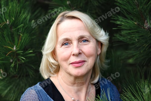 Preview: Portrait of senior woman in park.