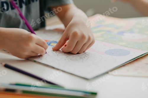 Preview: 5 years old boy preschool draws with a pencil
