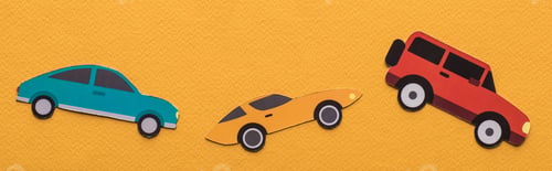 Preview: top view of paper cut cars on orange background, panoramic shot