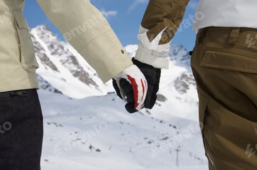 Preview: Snowboarders holding hands