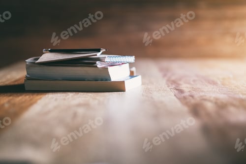 Preview: Books and notebooks on wooden table