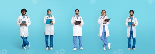 Preview: Smiling mature arabic and caucasian doctors in white coats with tablets and clipboards isolated on