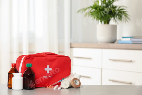 Preview: First aid kit on table indoors, space for text