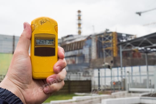 Preview: radiometer in hand with fourth reactor on the background