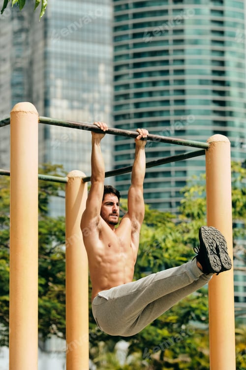 Preview: Adult Man Training ABS Abdominals Muscles Doing Calisthenics Outdoors