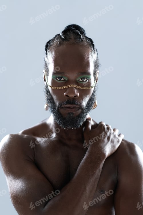 Preview: Shirtless African American bearded gay man with bright makeup