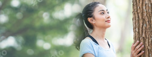 Preview: Woman Embracing Nature in a Forest Setting