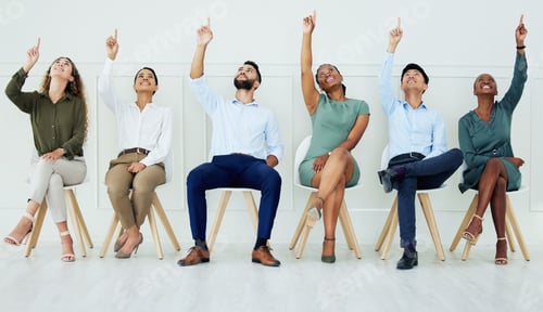 Preview: Business, team and office in teamwork collaboration sitting and pointing up together in solidarity