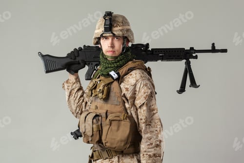 Preview: Soldier standing with rifle in military gear during training session indoors