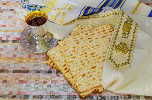 Preview: Jewish Pesah celebrating, matzoh and traditional seder plate with tallit, Passover holiday