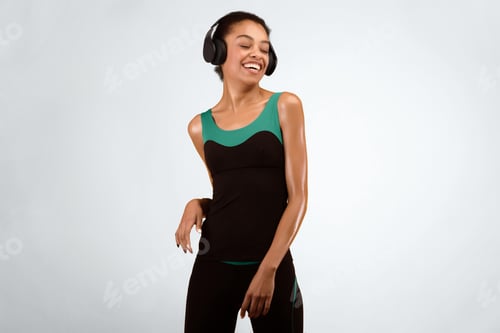 Preview: Happy Afro Girl In Headphones Dancing In Studio