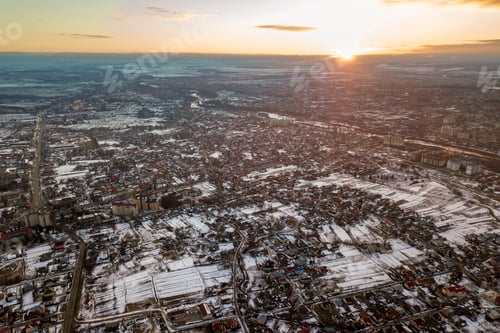 Preview: Top view of city suburbs or small town nice houses on winter morning on cloudy sky