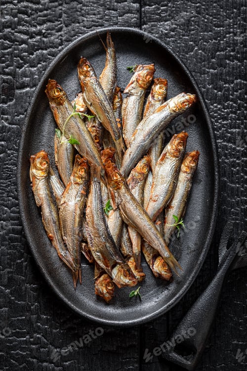 Preview: Fresh smoked sprats marinated with spices and salt.