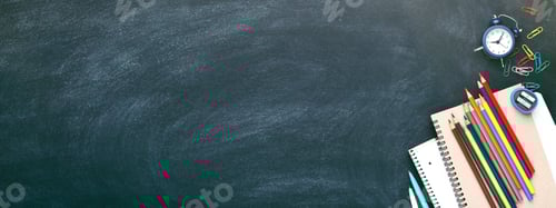 Preview: Banner with School Stationary on Blackboard.