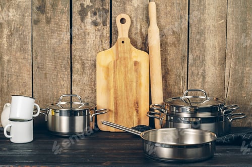 Preview: Set of dishware against old wooden background